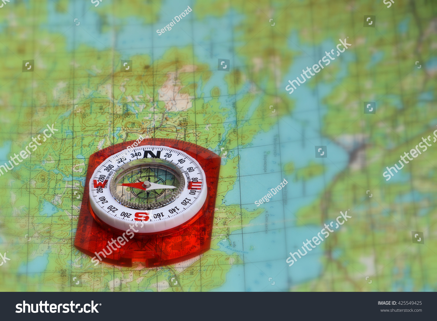 Orienteering Using Map Compass Magnetic Compass Stock Photo 425549425   Stock Photo Orienteering Using A Map And Compass Magnetic Compass On A Topographic Map 425549425 