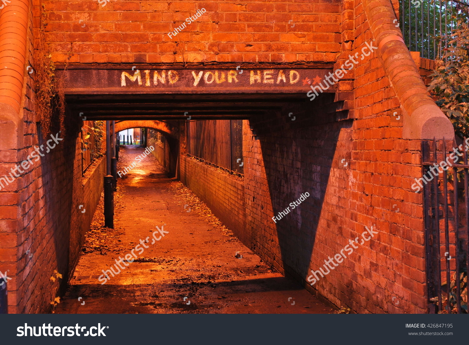 mind-your-head-warning-sign-over-stock-photo-426847195-shutterstock