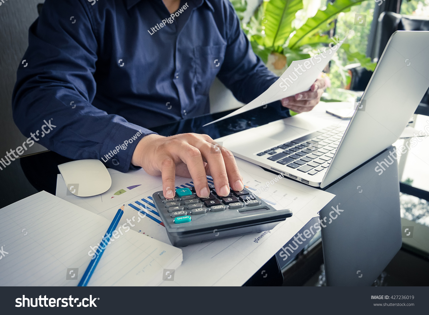 Business Man Using Calculator Calculate Numbers Stock Photo