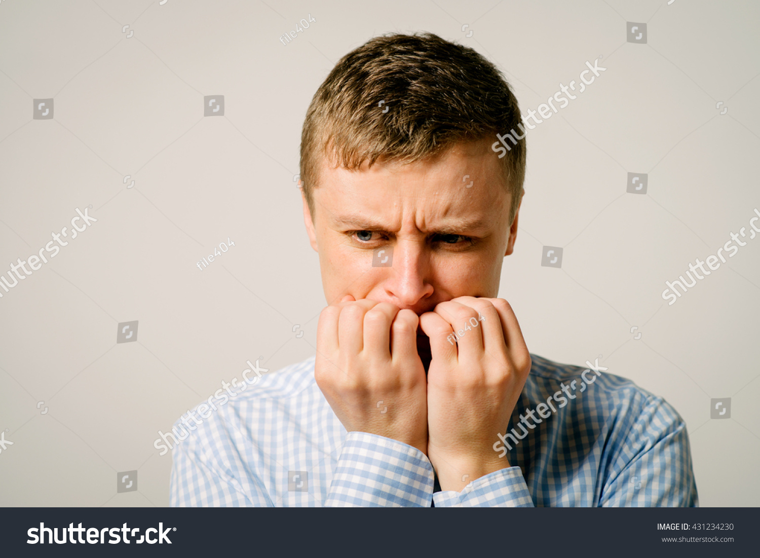 man-bites-his-nails-stock-photo-431234230-shutterstock