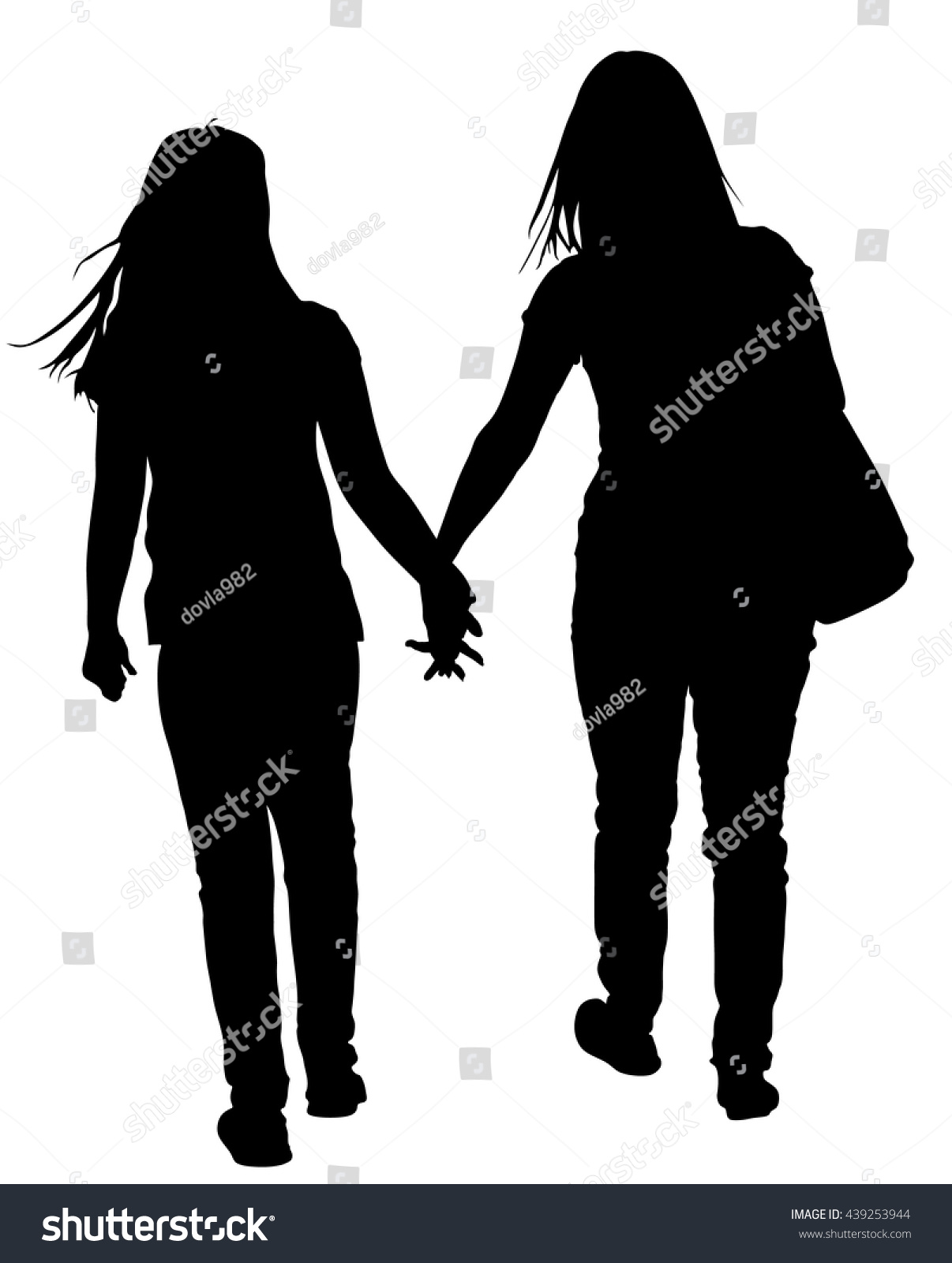 two girls holding hands silhouette