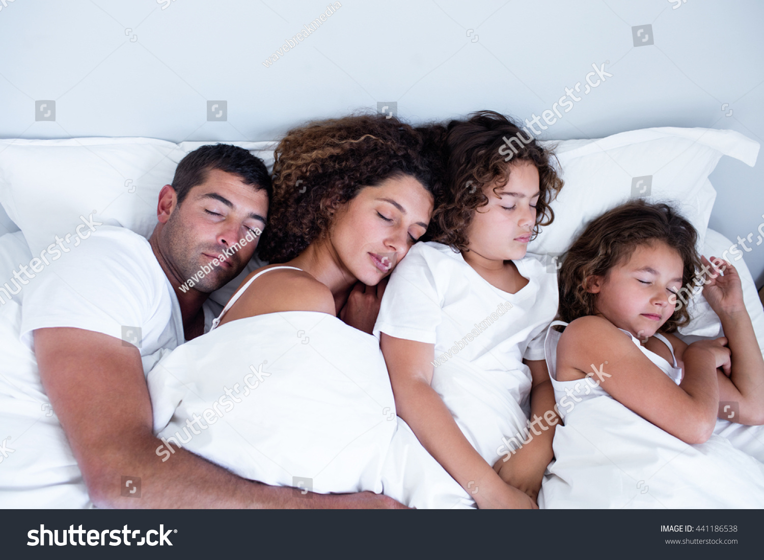 Family Sleeping Together On Bed Bedroom Stock Photo 441186538   Stock Photo Family Sleeping Together On Bed In Bedroom 441186538 