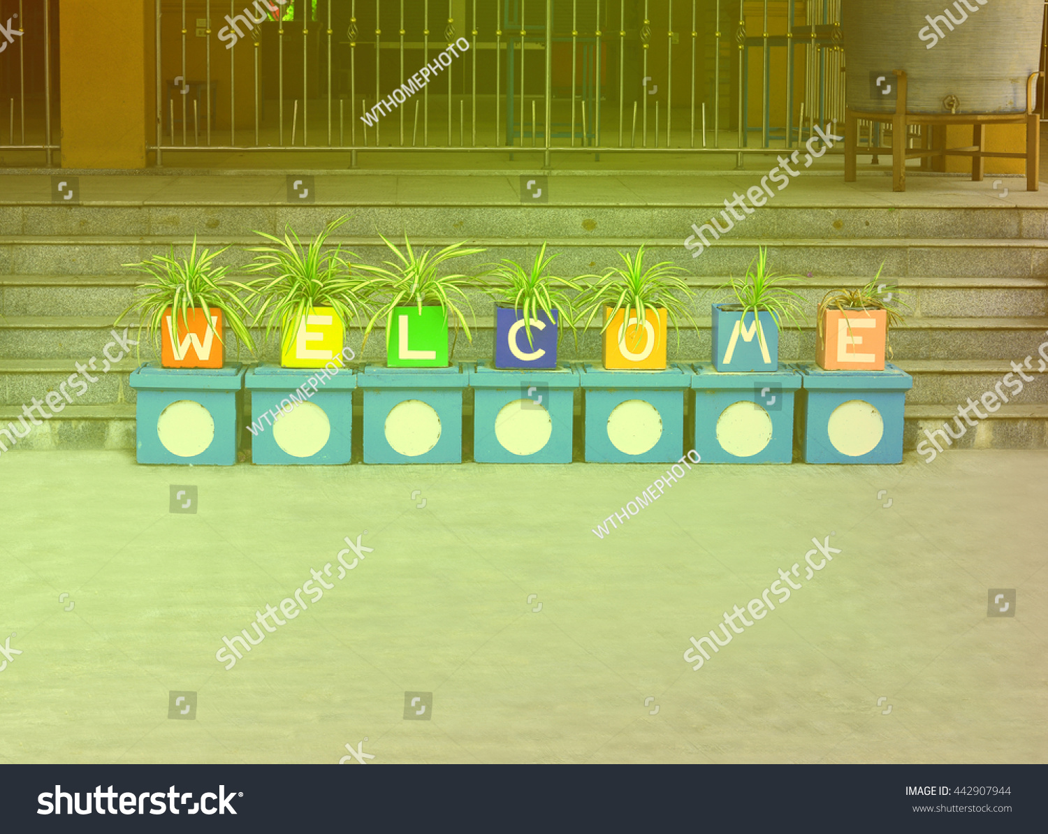 welcome-word-made-jardinieres-on-stair-stock-photo-442907944-shutterstock