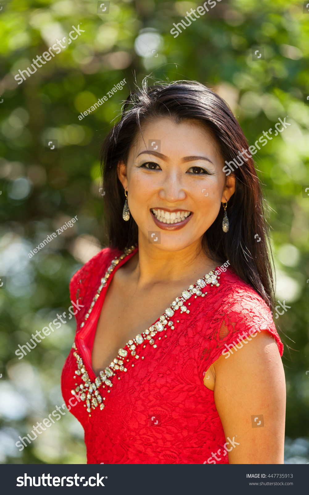 Sexy Mature Asian Woman Red Dress Stock