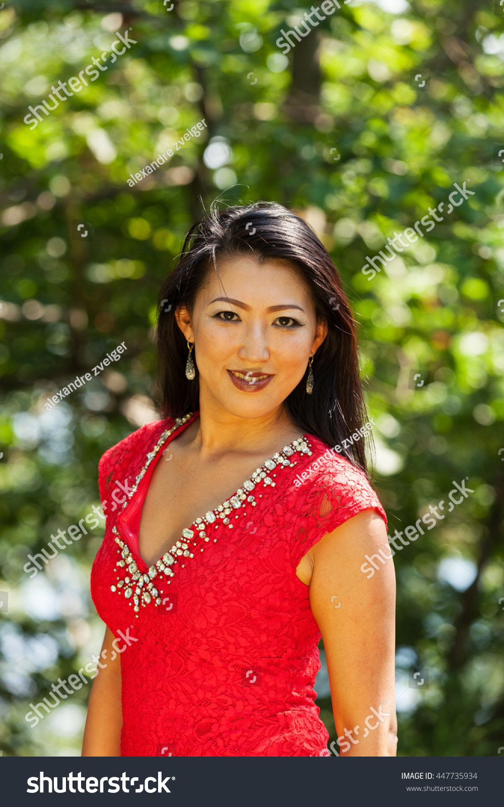 Sexy Mature Asian Woman Red Dress Stock picture