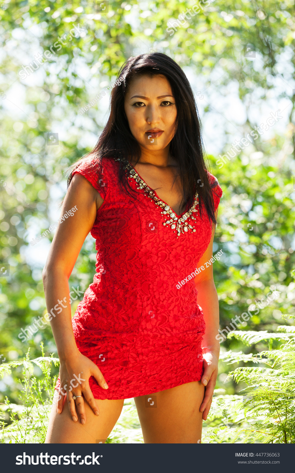 Sexy Mature Asian Woman Red Dress Stock