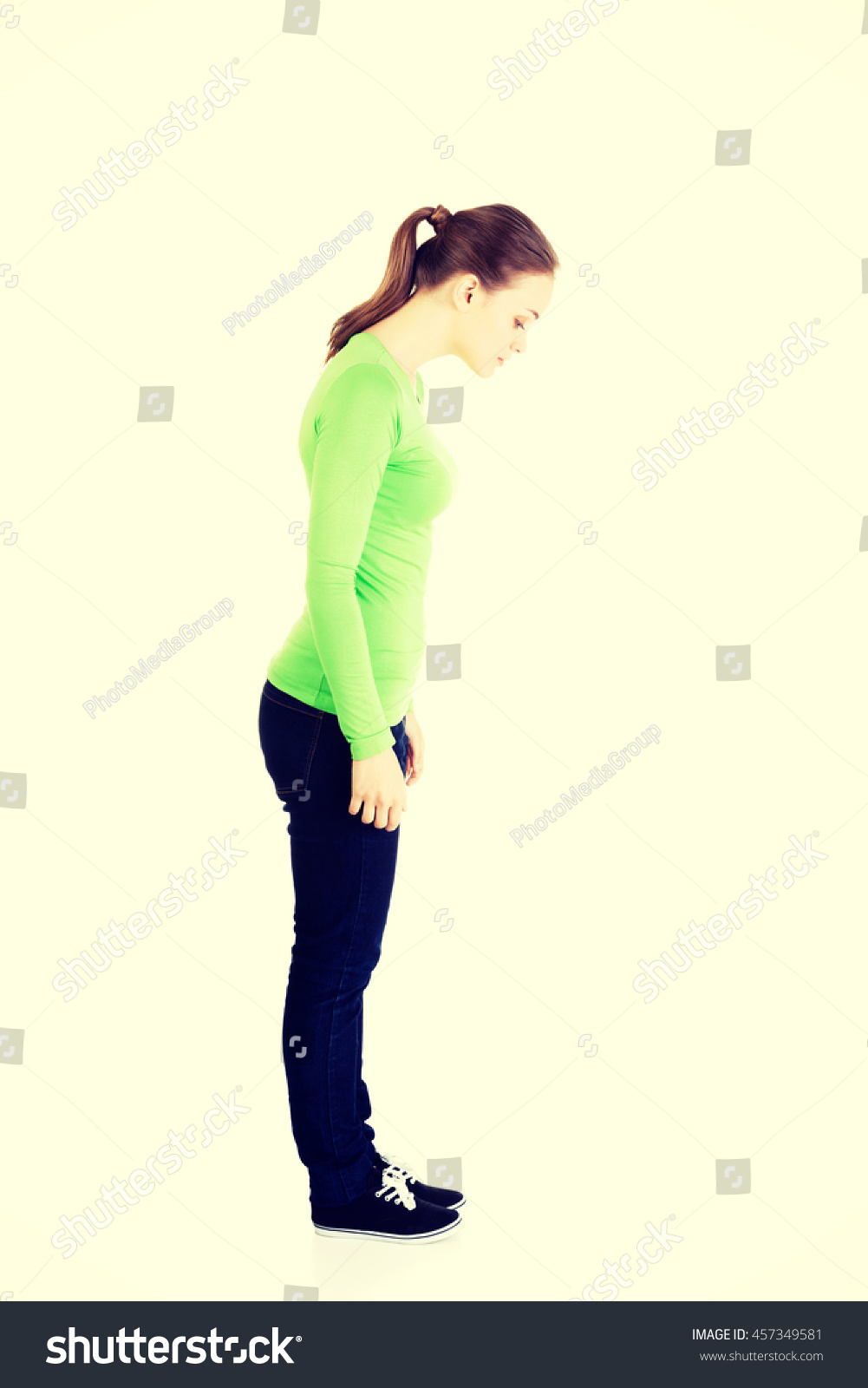 Woman Standing Looking Down Stock Photo 457349581 | Shutterstock