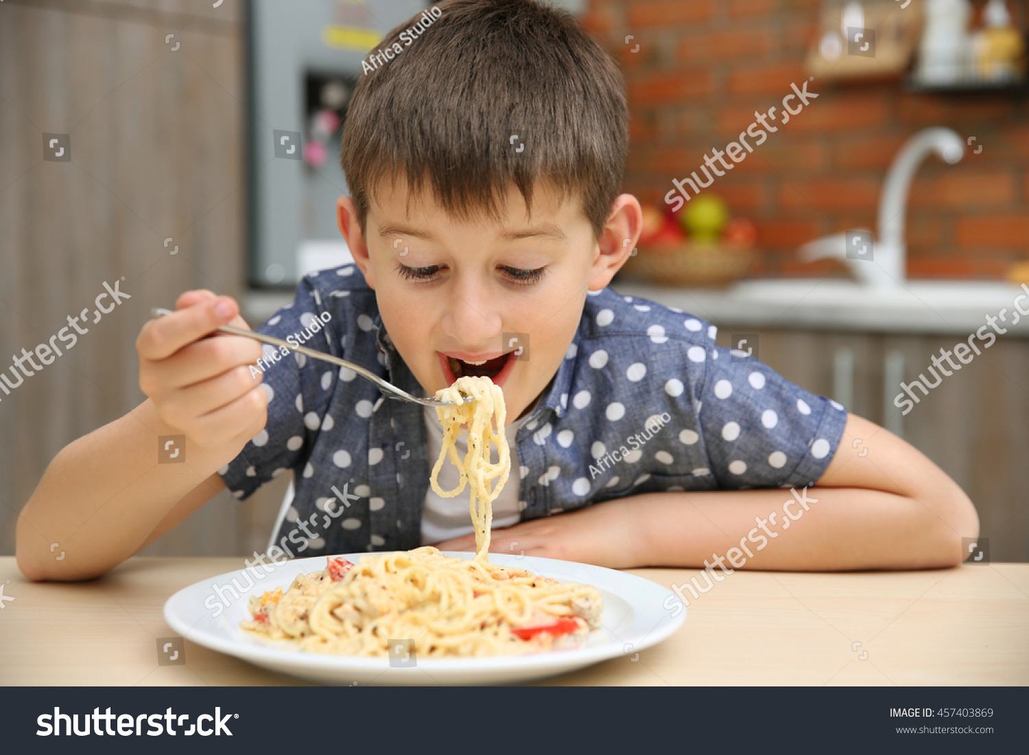 Cute Boy Eating Spaghetti On Kitchen Stock Photo 457403869 | Shutterstock