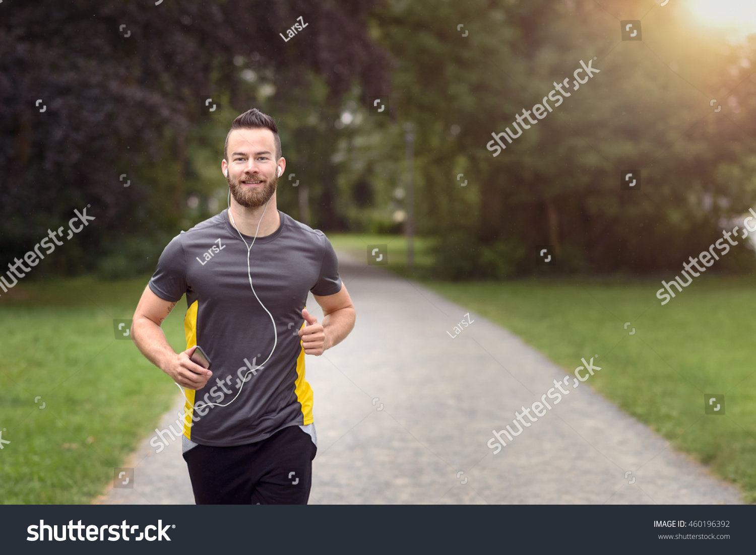 Fit Bearded Young Man Jogging Through Stock Photo 460196392 Shutterstock