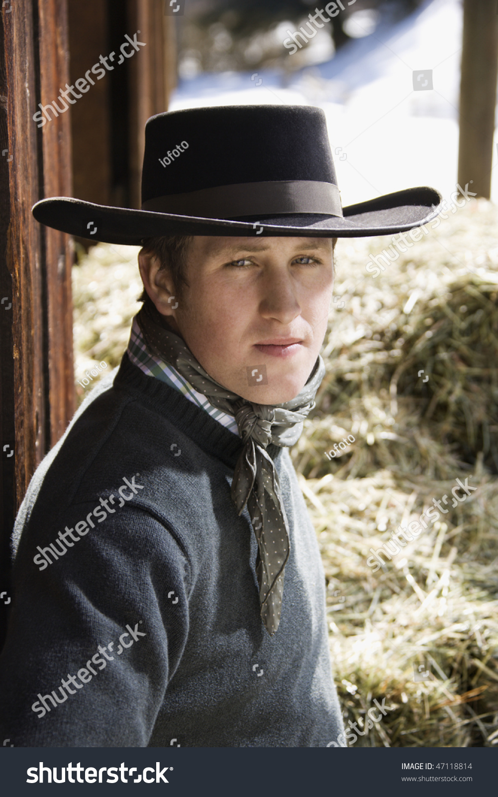 wearing black cowboy hat