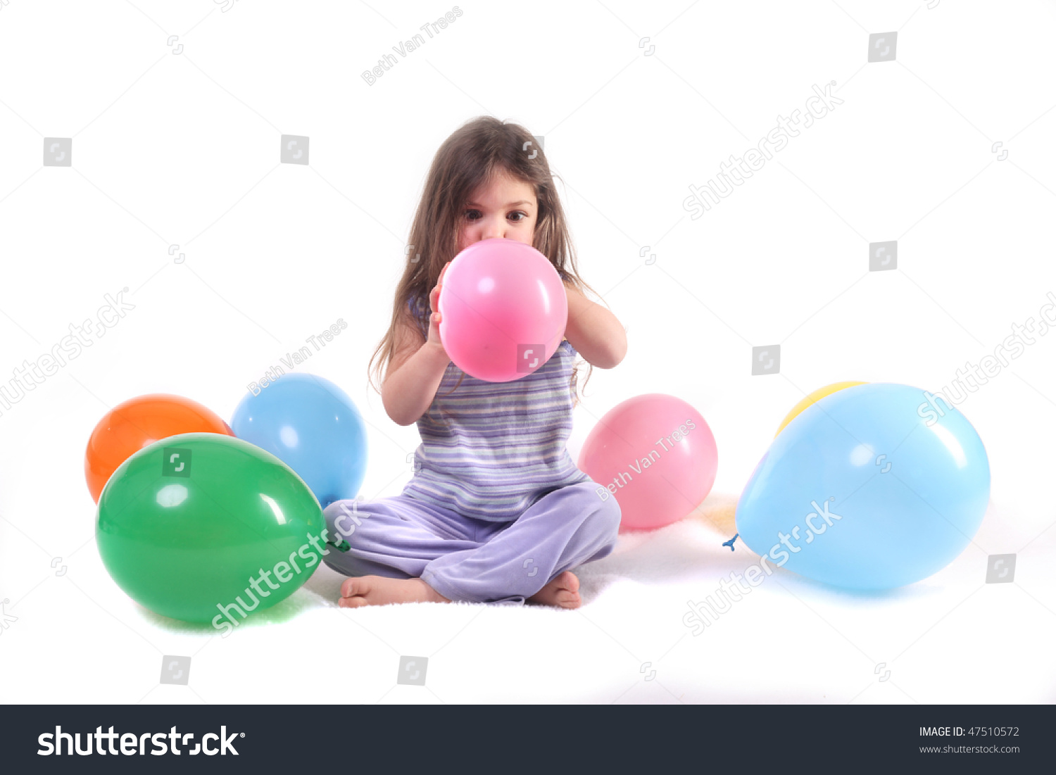 Girls Blowing Balloons