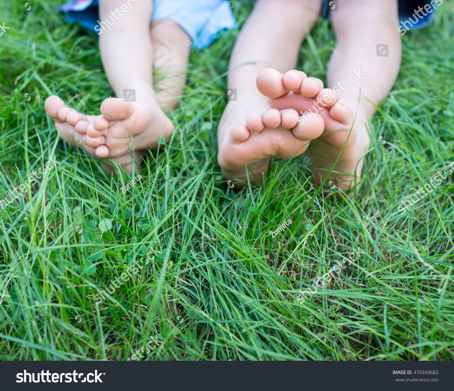 Group Happy Children Feet Lying On Stock Photo 476349682 