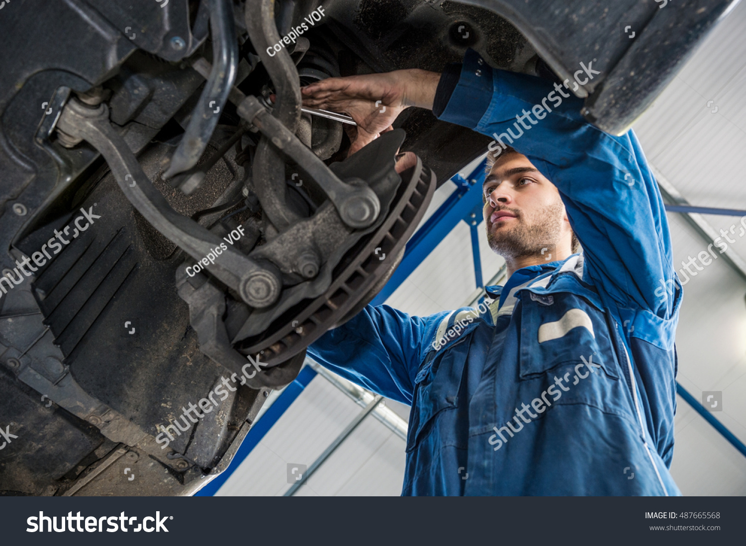 Low Angle View Male Mechanic Repairing Stock Photo 487665568 | Shutterstock