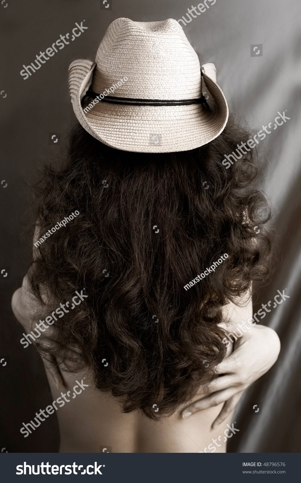 curly hair with cowboy hat