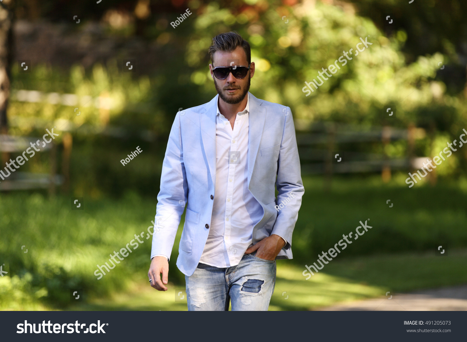 attractive-man-wearing-light-blue-blazer-stock-photo-491205073-shutterstock