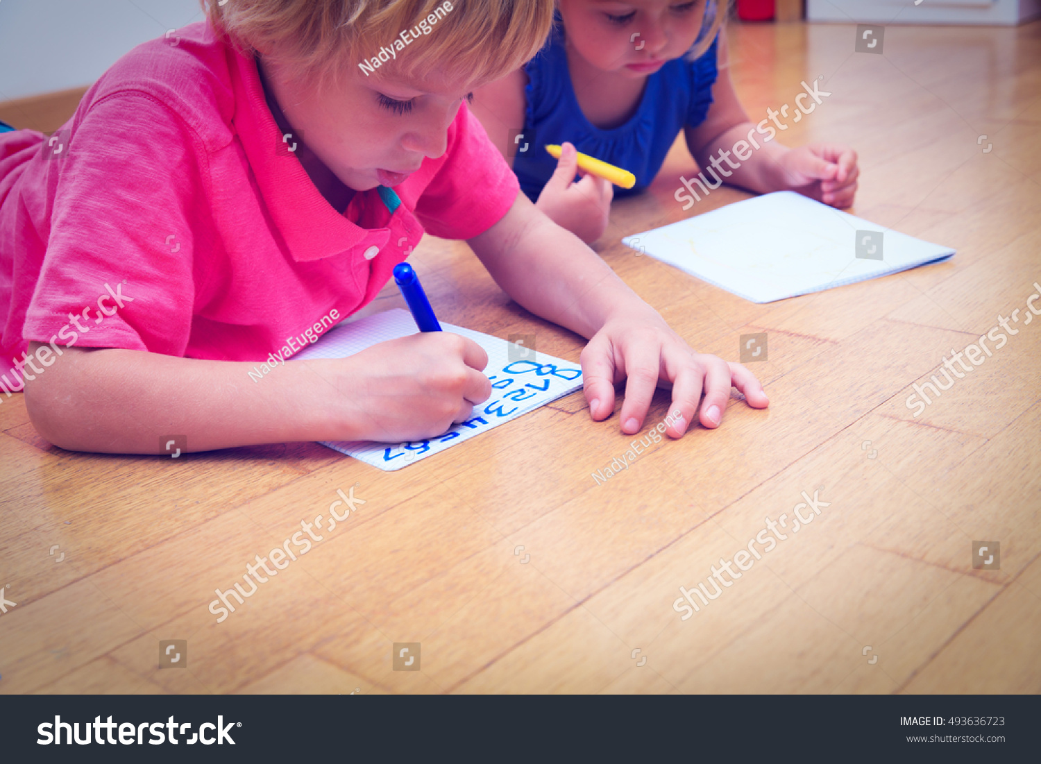 kids-learning-write-numbers-stock-photo-493636723-shutterstock