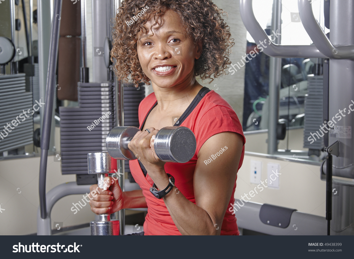 African American Woman Doing Bicep Curls Stock Photo 49438399 ...