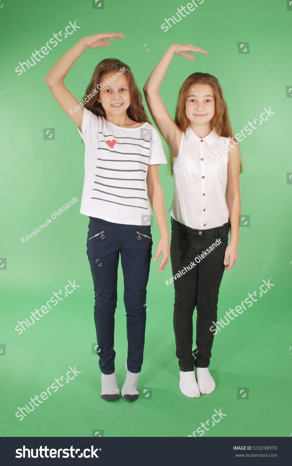 two-school-girls-hold-hands-above-stock-photo-533298970-shutterstock