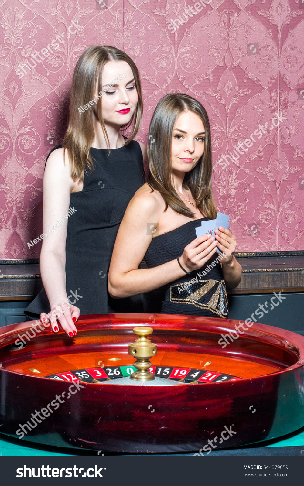 stock-photo-two-girls-in-casino-with-car