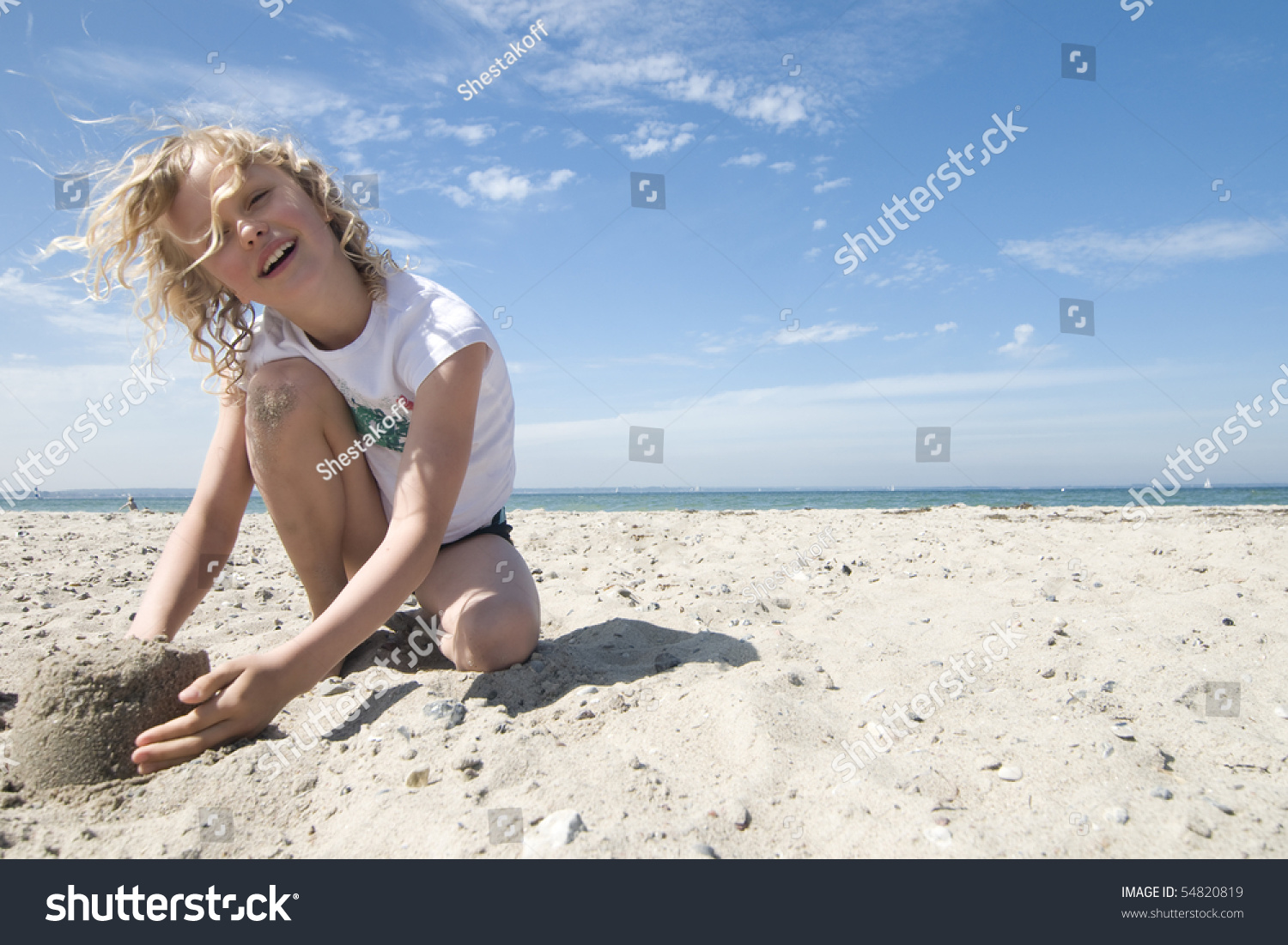 Стоковая фотография 54820819: Girl Playing Sand Summer Vacation On Shutters...