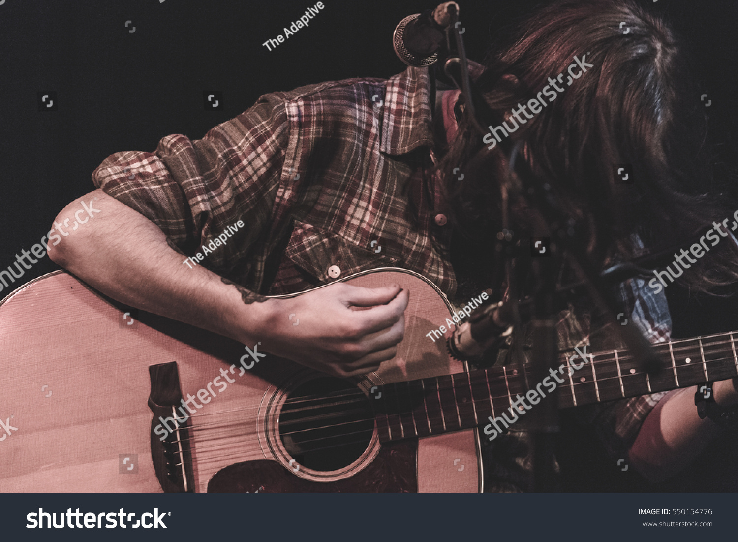 acoustic guitar player on stage