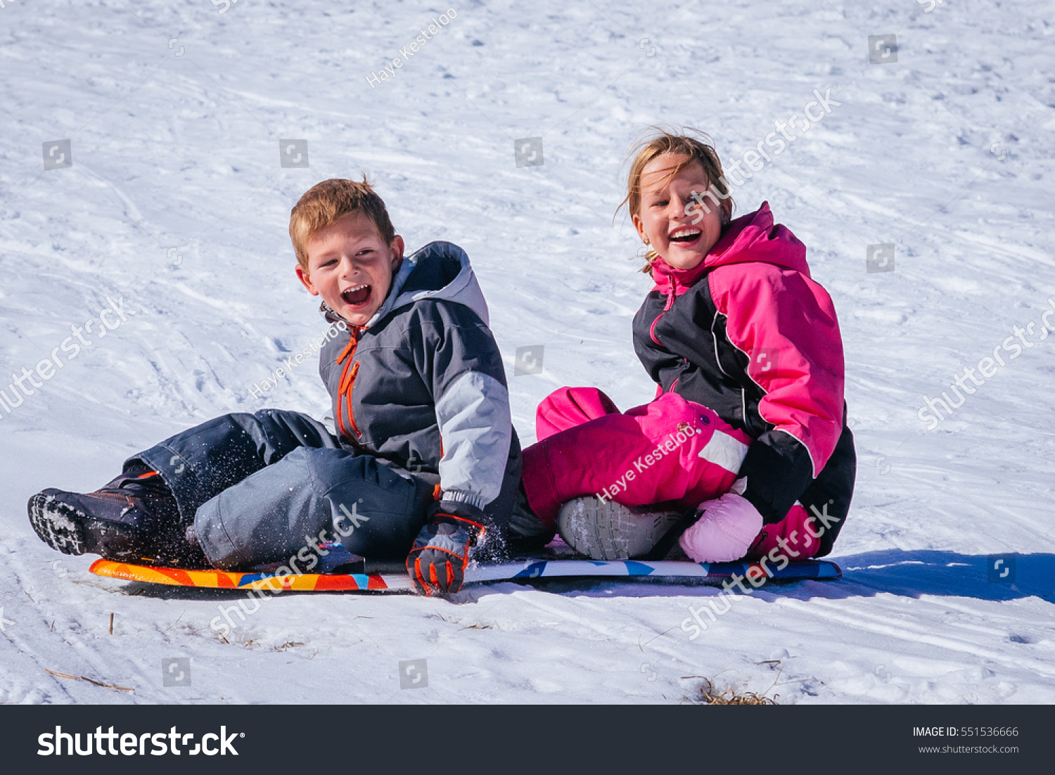 Brother Sister Sliding Sideways Down Snowy Stock Photo 551536666 ...