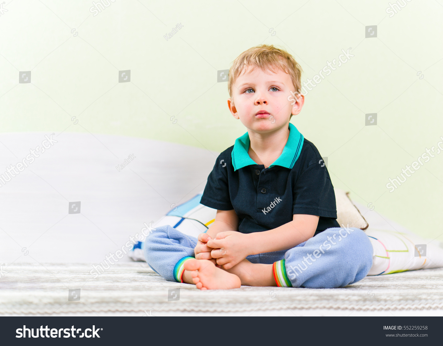 Skinny Blond Kid Sitting On Haunches Stock Photo 552259258 | Shutterstock