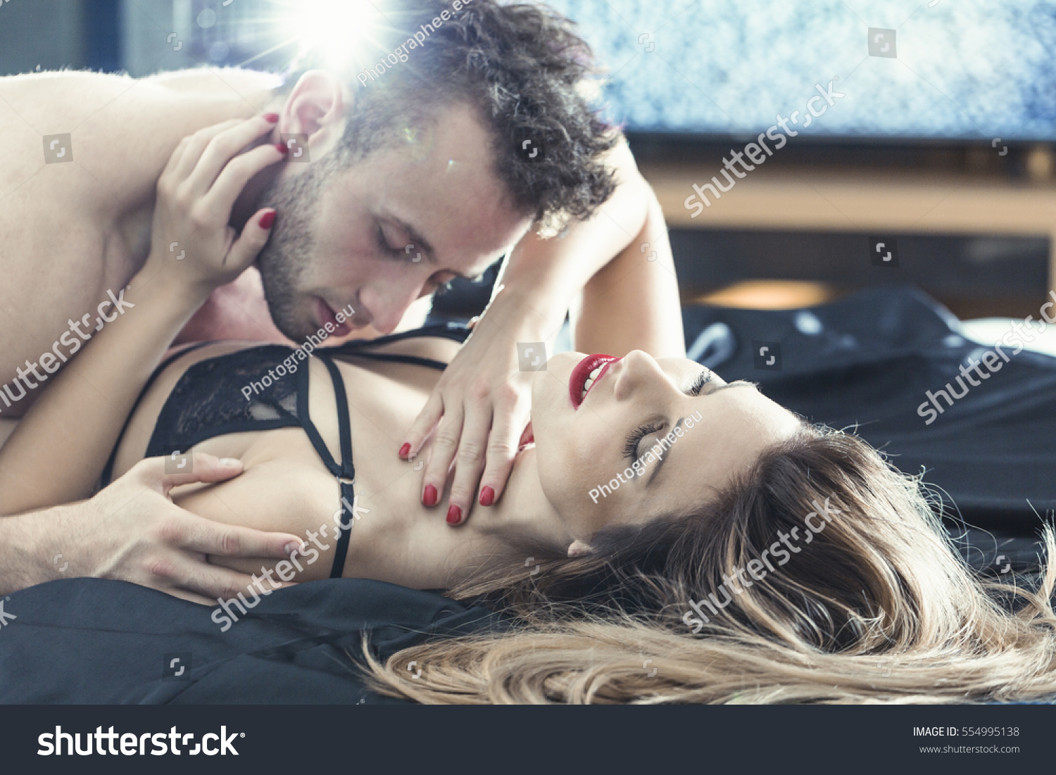 Man Kissing Woman Boobs