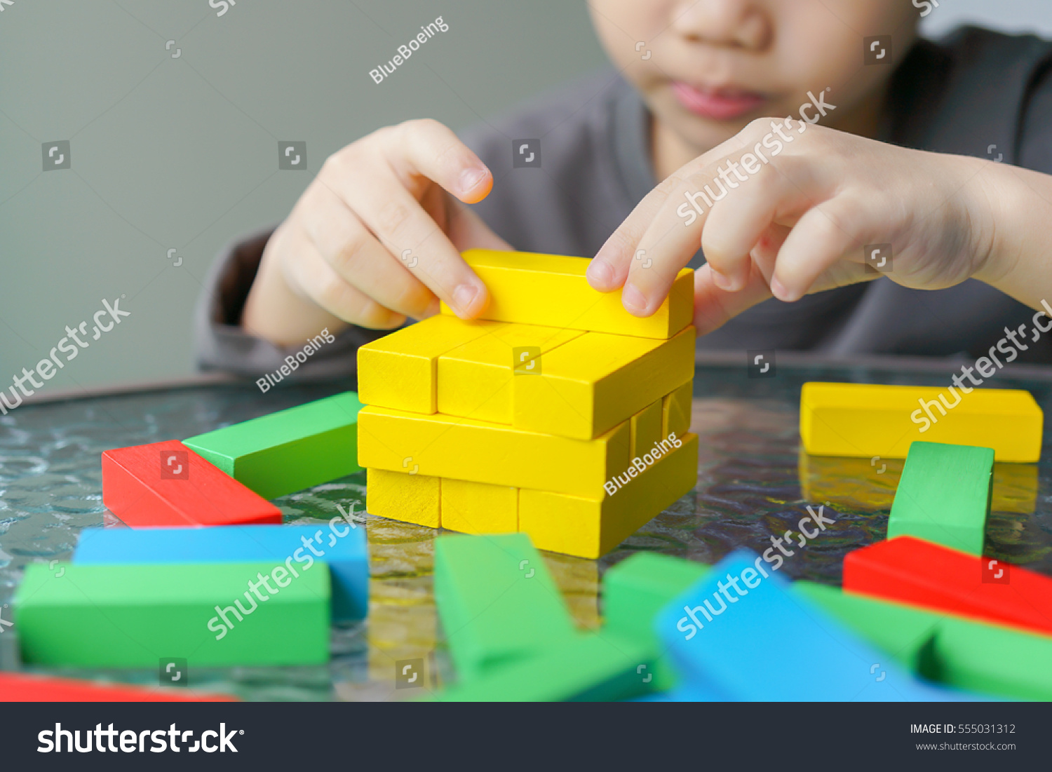 Asian Child Playing Colorful Wood Blocks Stock Photo 555031312