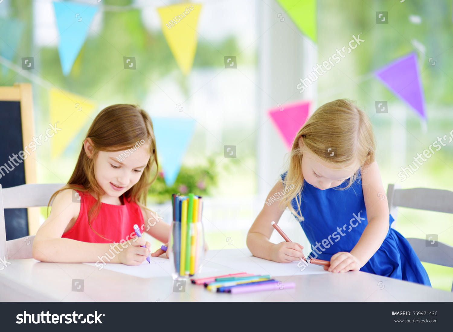 Two Cute Little Sisters Drawing Colorful Stock Photo 559971436 ...