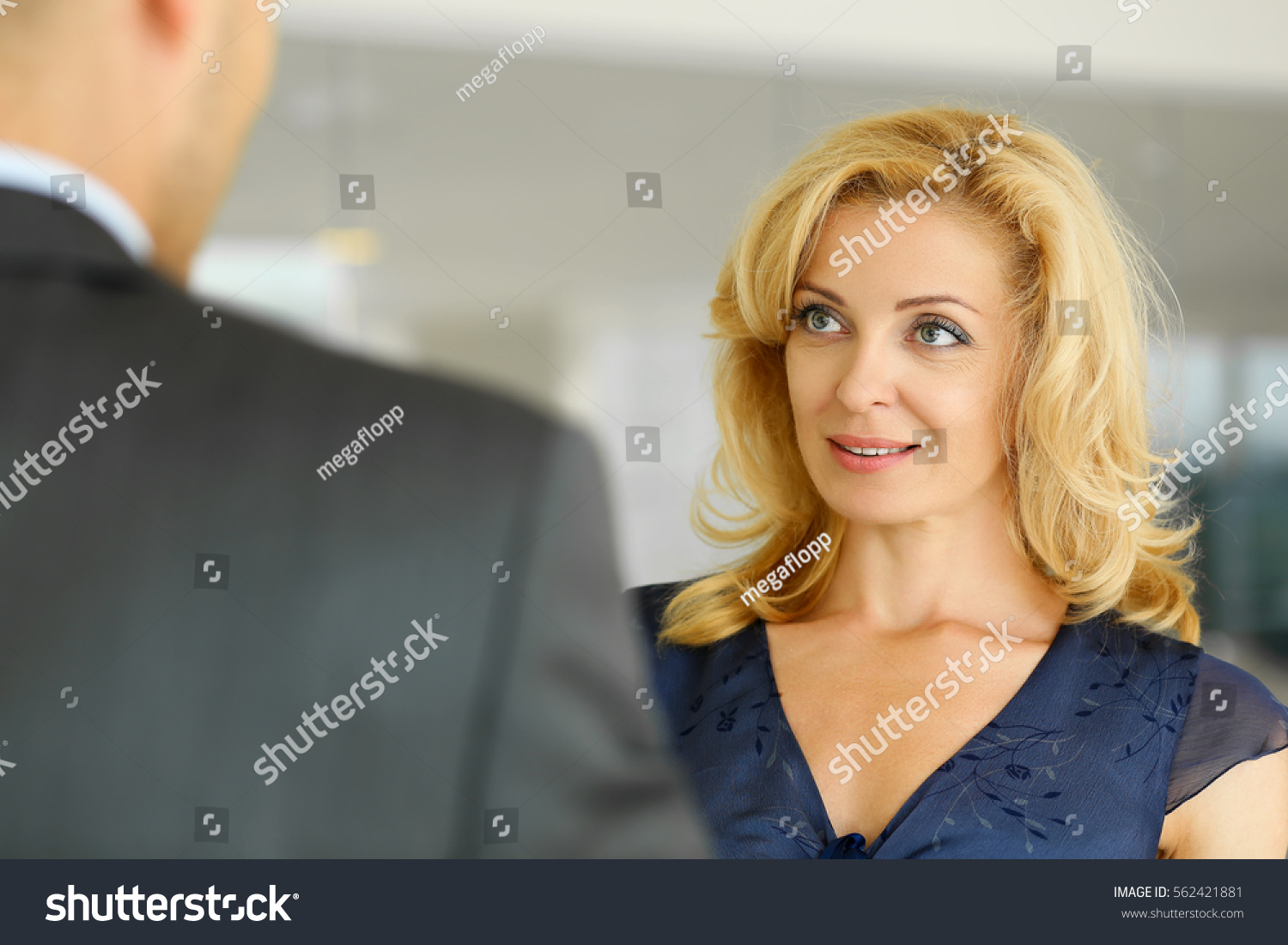 Man Smiling Mature Woman Talking Office