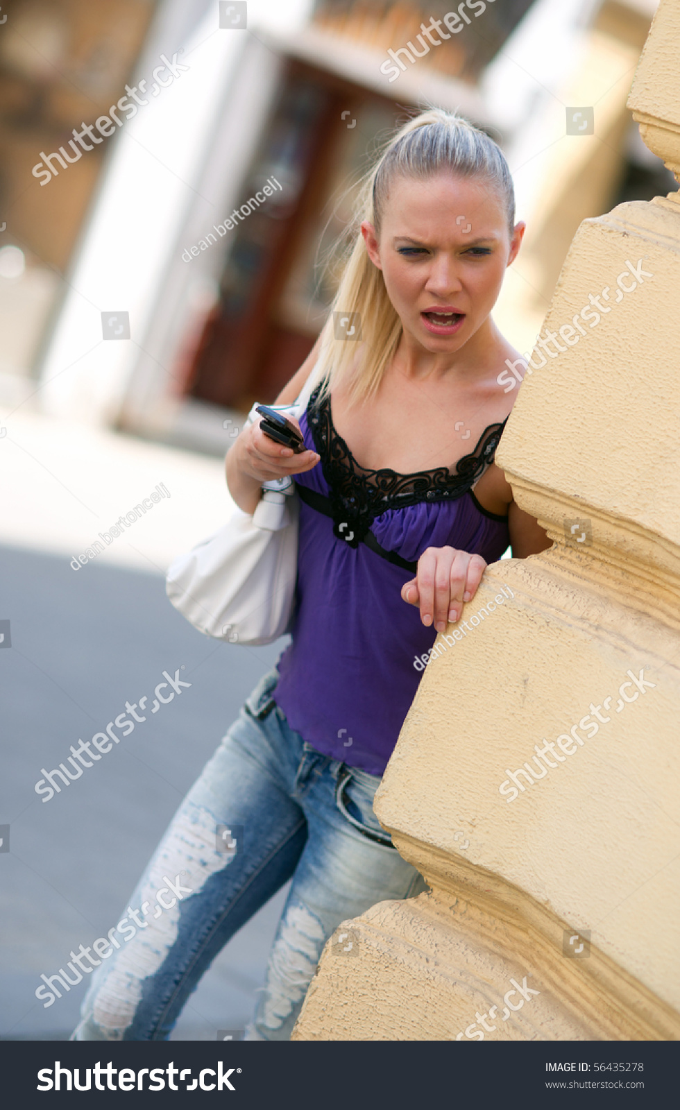 girl hiding in corner