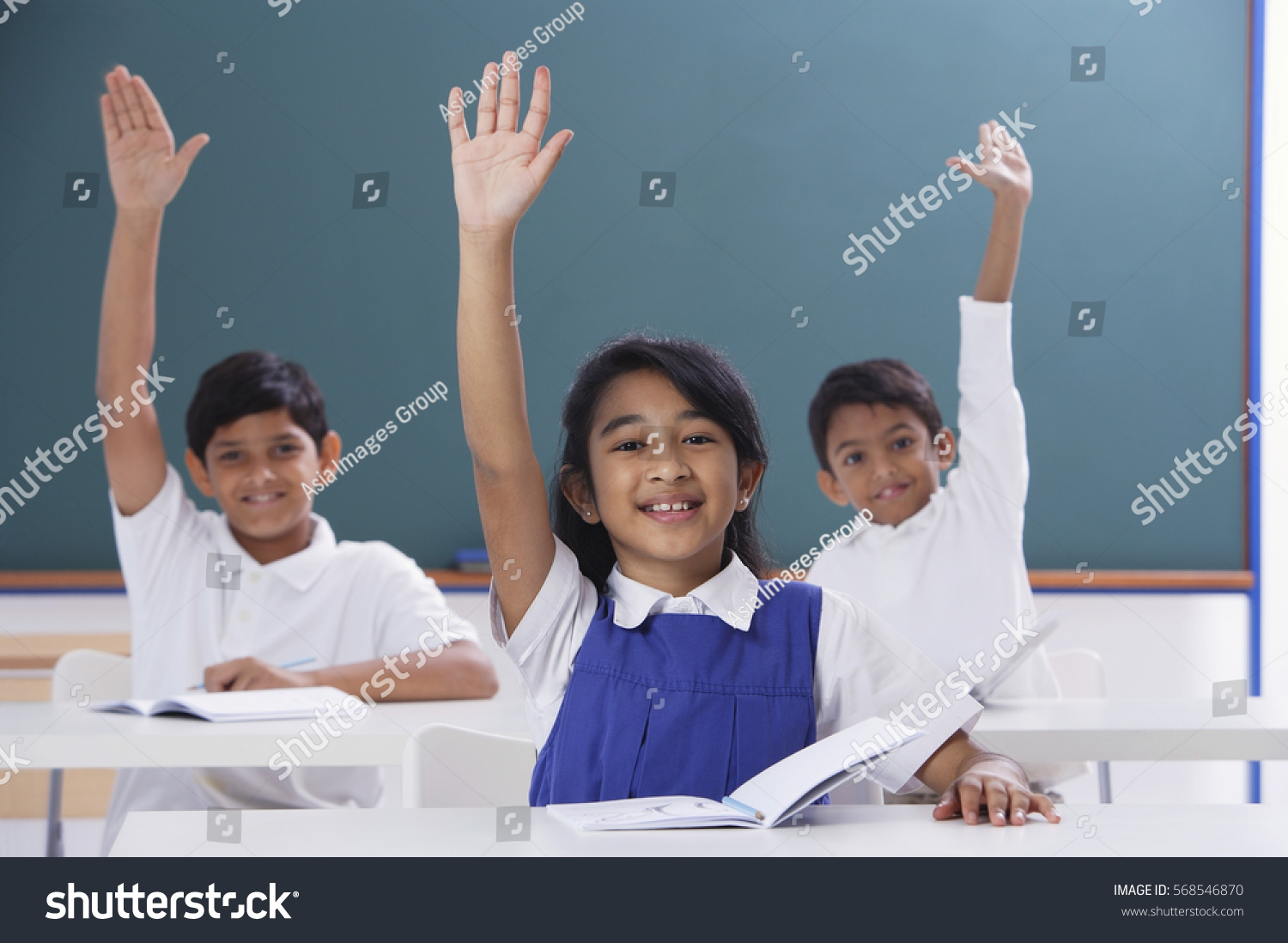 Three Students Raised Hands Stock Photo 568546870 | Shutterstock