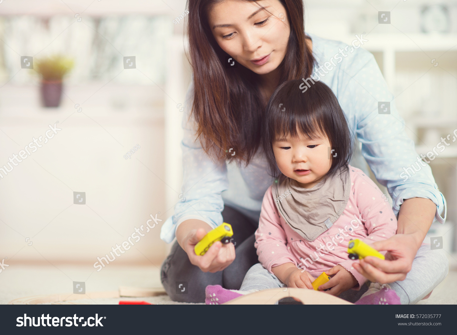 Pretty Happy Japanese Mother Play Her
