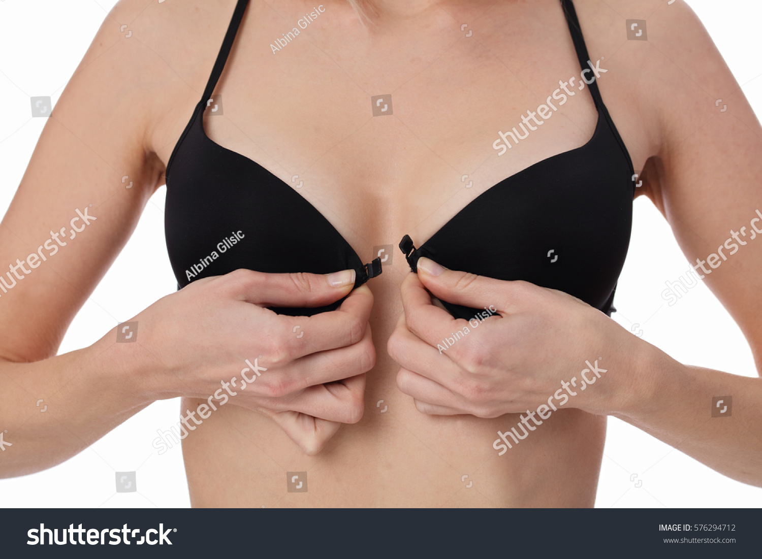 7eer.net Woman Taking Off Bra Wearing Black Foto de stock 576294712 S.