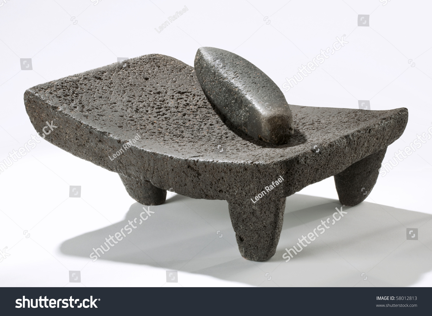 stock-photo-metate-mexican-stone-utensil-used-for-grinding-corn-sauces-and-pastes-by-hand-58012813.jpg