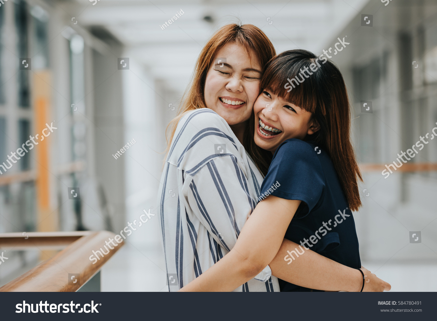 Two Beautiful Happy Asian Girls Friends photo