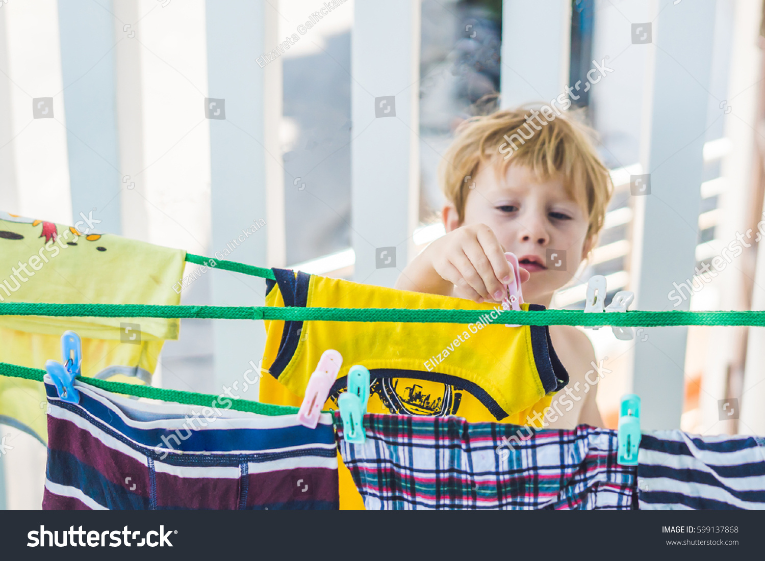 Little Boy Helps Her Mother Hang Stock Photo 599137868 | Shutterstock