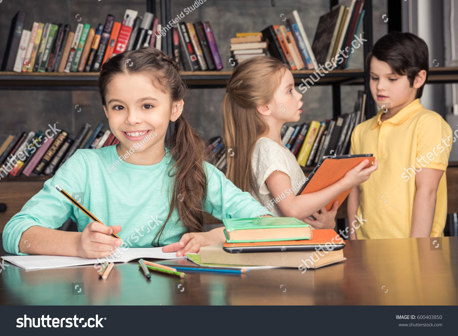 Portrait Smiling Girl Doing Homework Classmates Stock Photo 600403850 ...