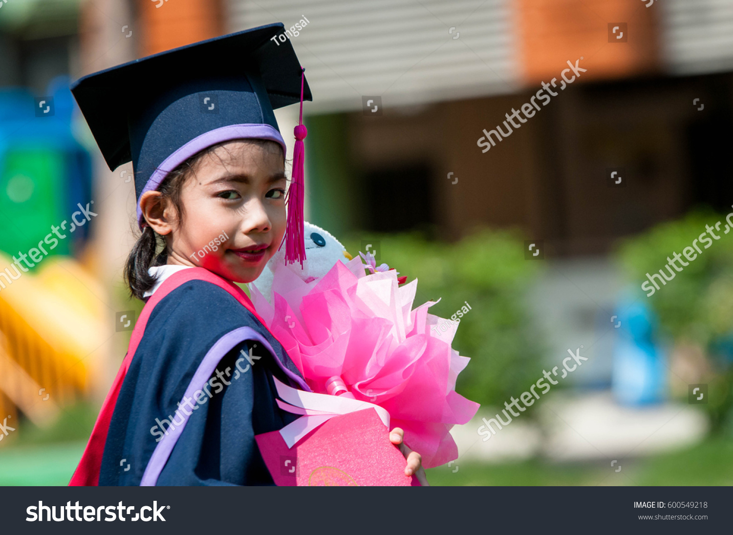 young-graduates-happy-on-graduation-day-stock-photo-600549218