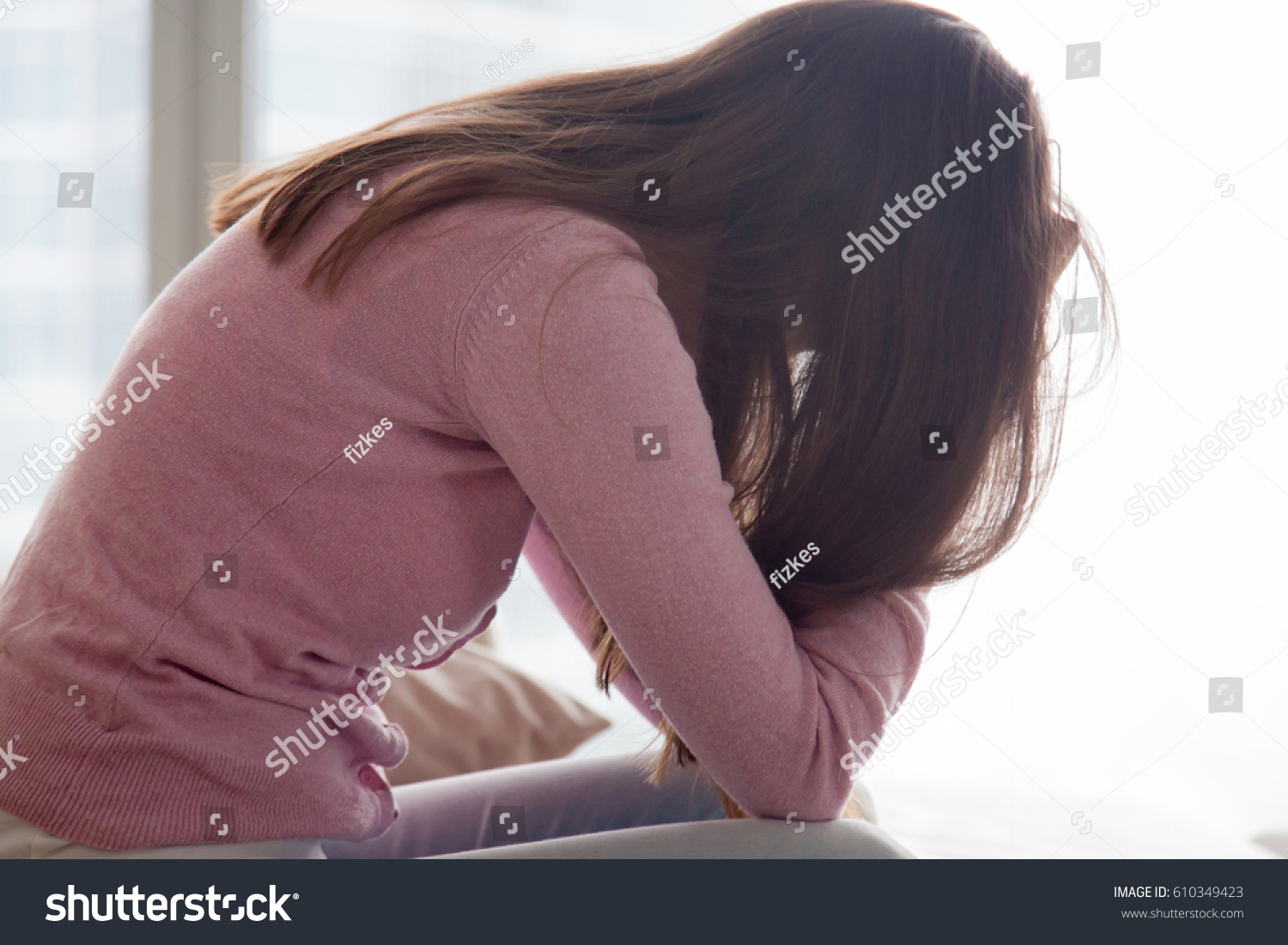 Young Depressed Woman Sitting Alone Holding Stock Photo 610349423 ...