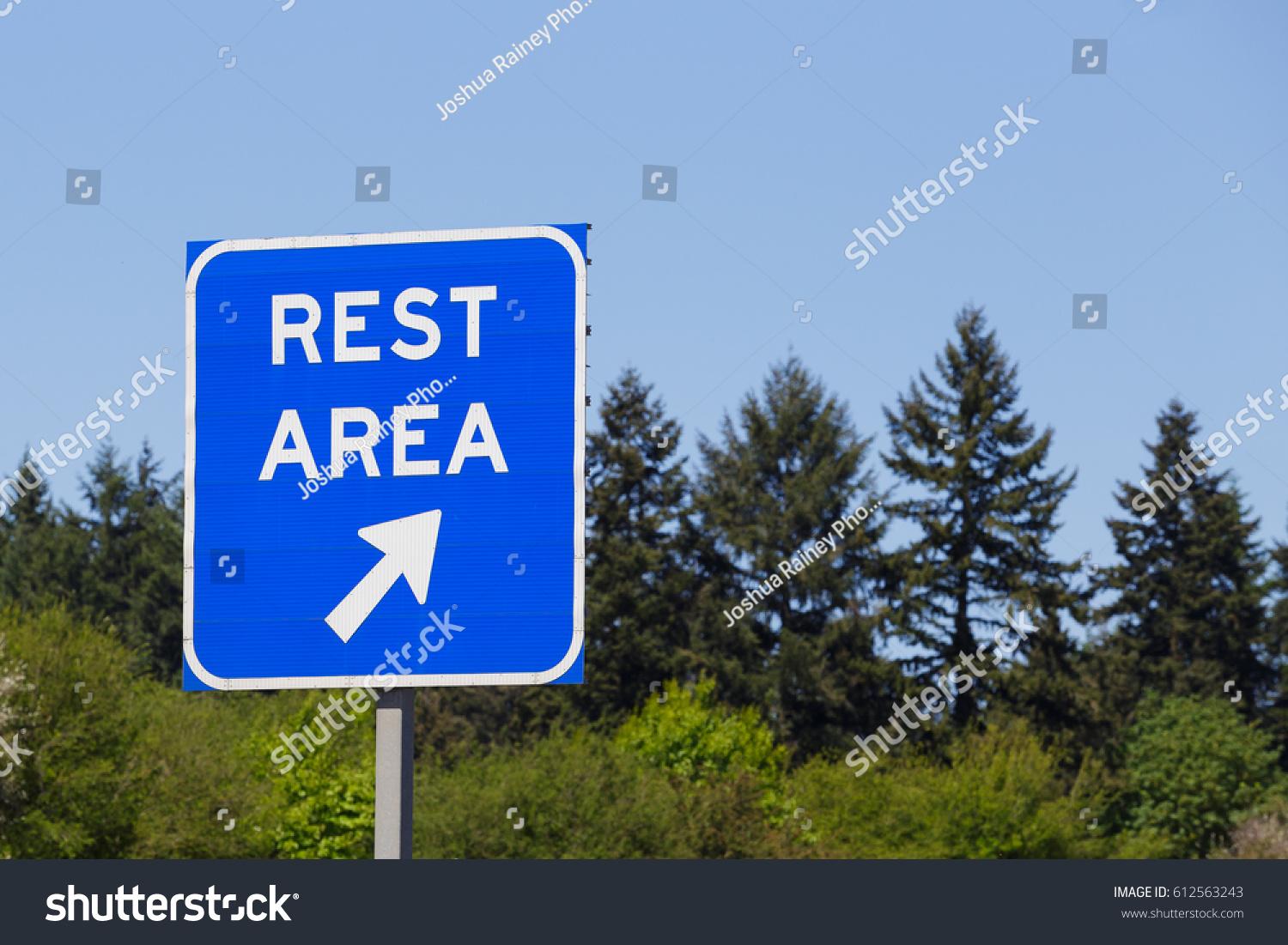 blue-rest-area-sign-points-highway-stock-photo-612563243-shutterstock