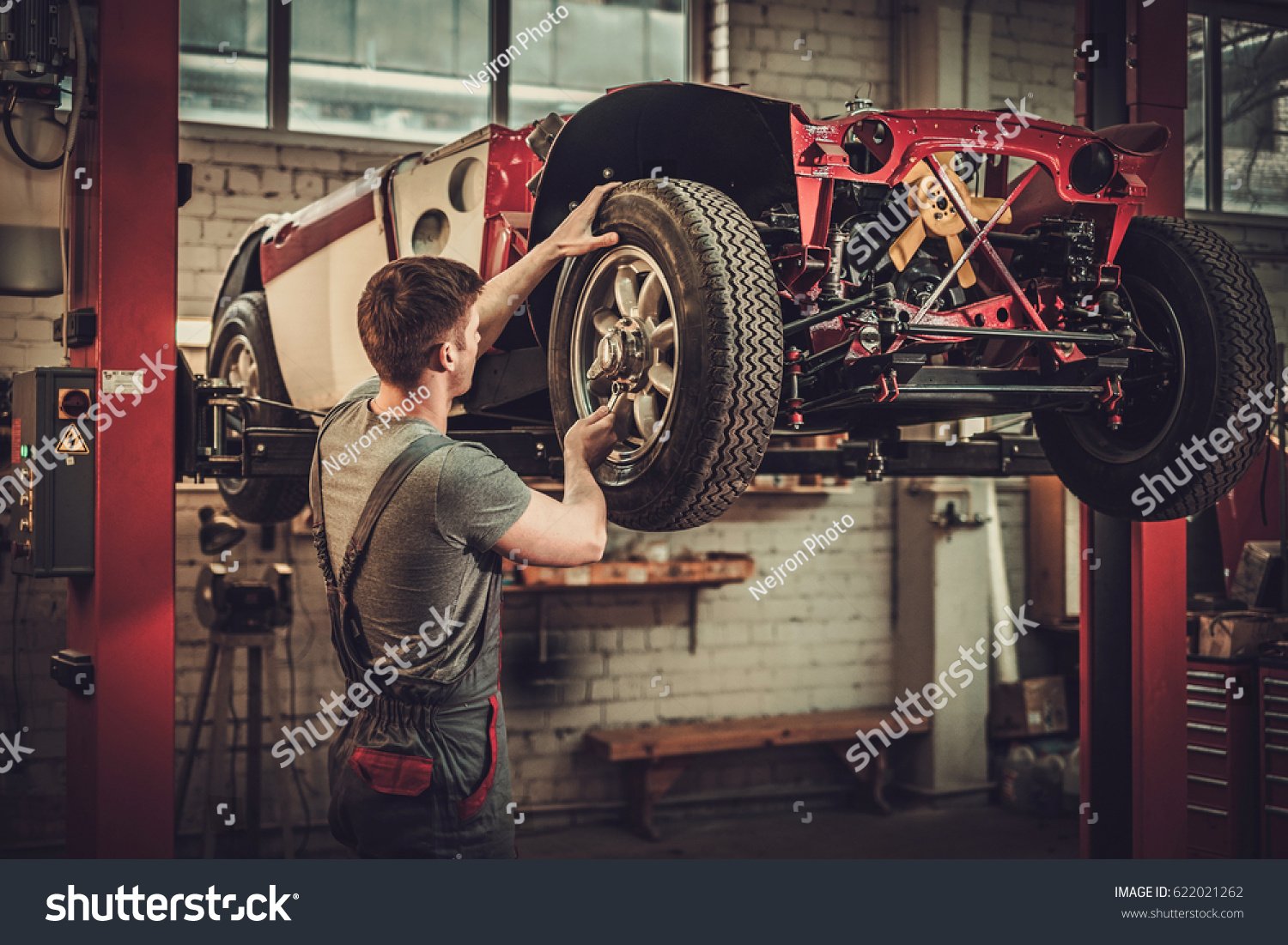 Mechanic Working On Classic Car Wheels Stock Photo 622021262 | Shutterstock