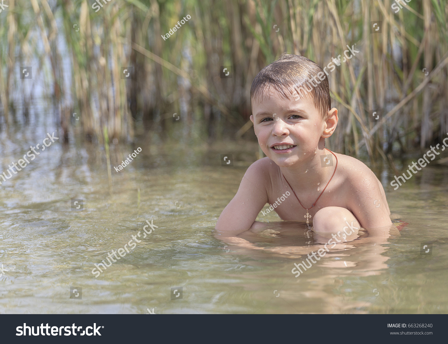 boy swimming in river