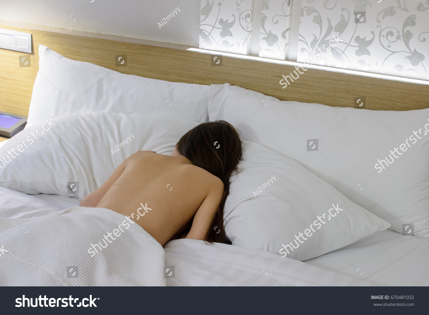 Naked Woman Sleep On White Pillow Stock picture