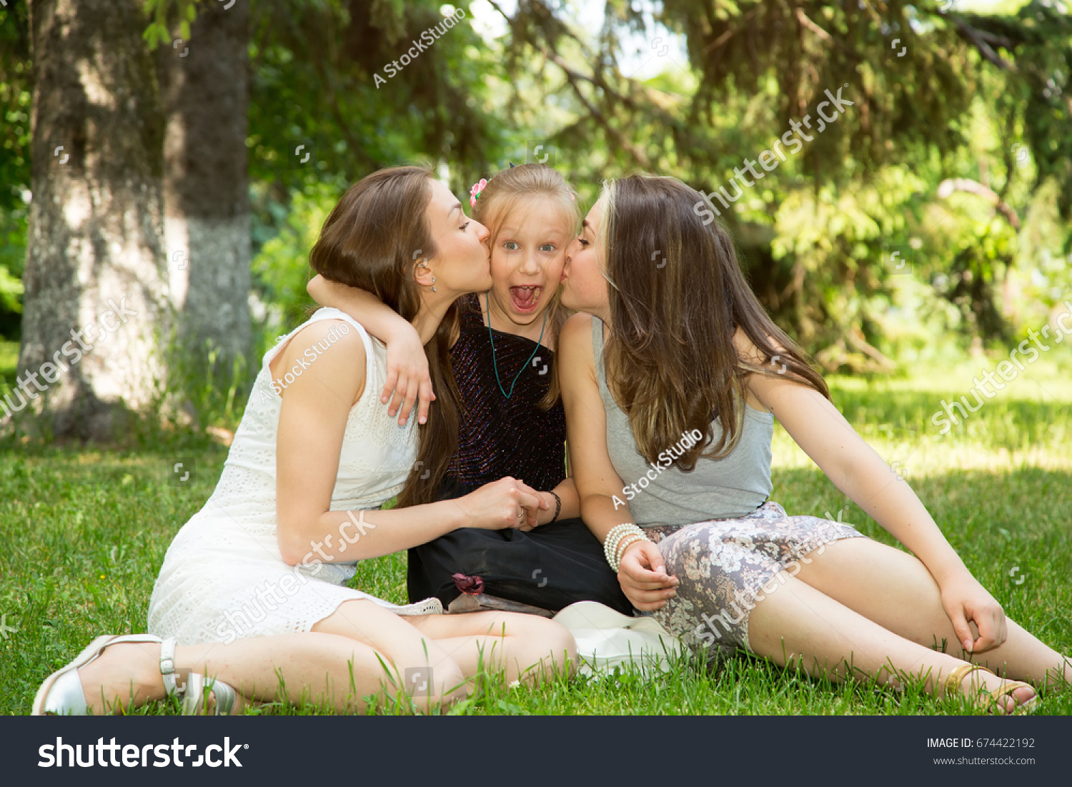Three Girls Kissing Each Other