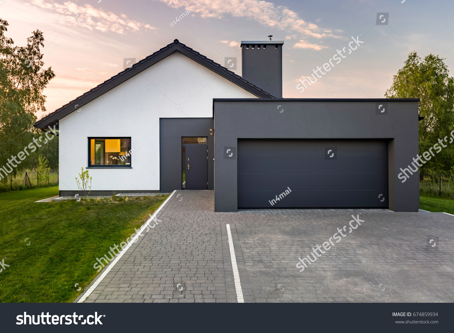 22 959 Beautiful Garage House Shutterstock   Stock Photo Modern House With Garage And Green Lawn Exterior View 674859934 