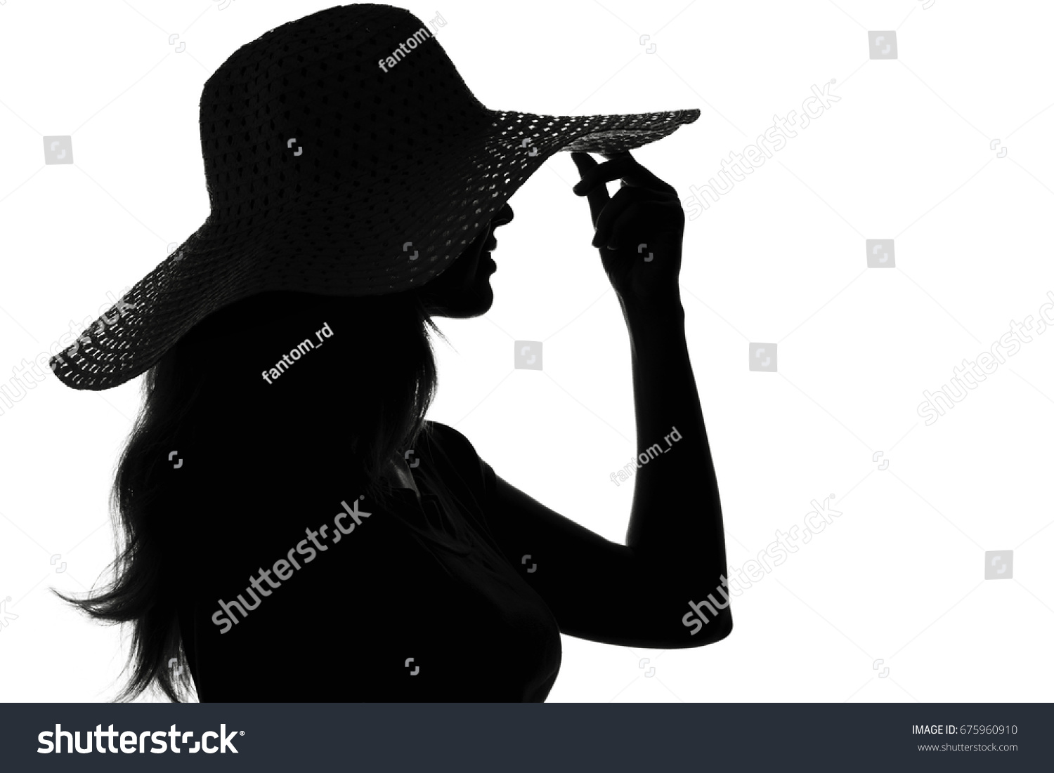 Девушка в шляпе с закрытым лицом