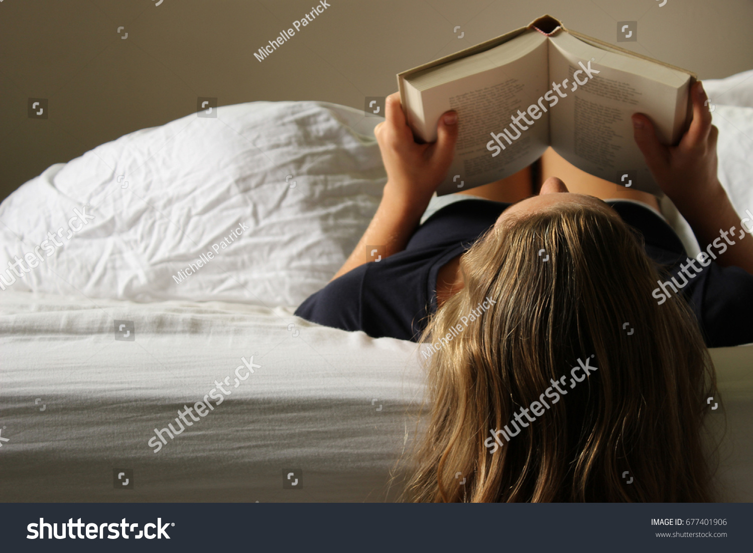 young-woman-lays-over-edge-bed-stock-photo-677401906-shutterstock