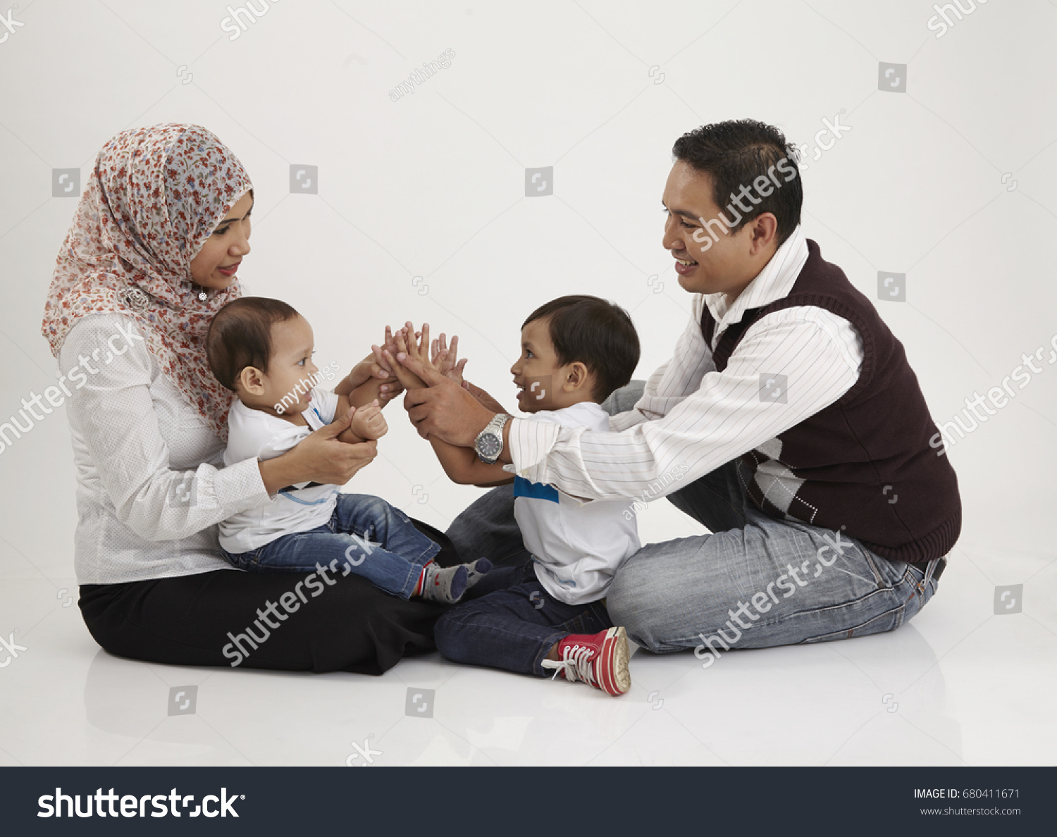 Family Playing Together On White Background Stock Photo 680411671